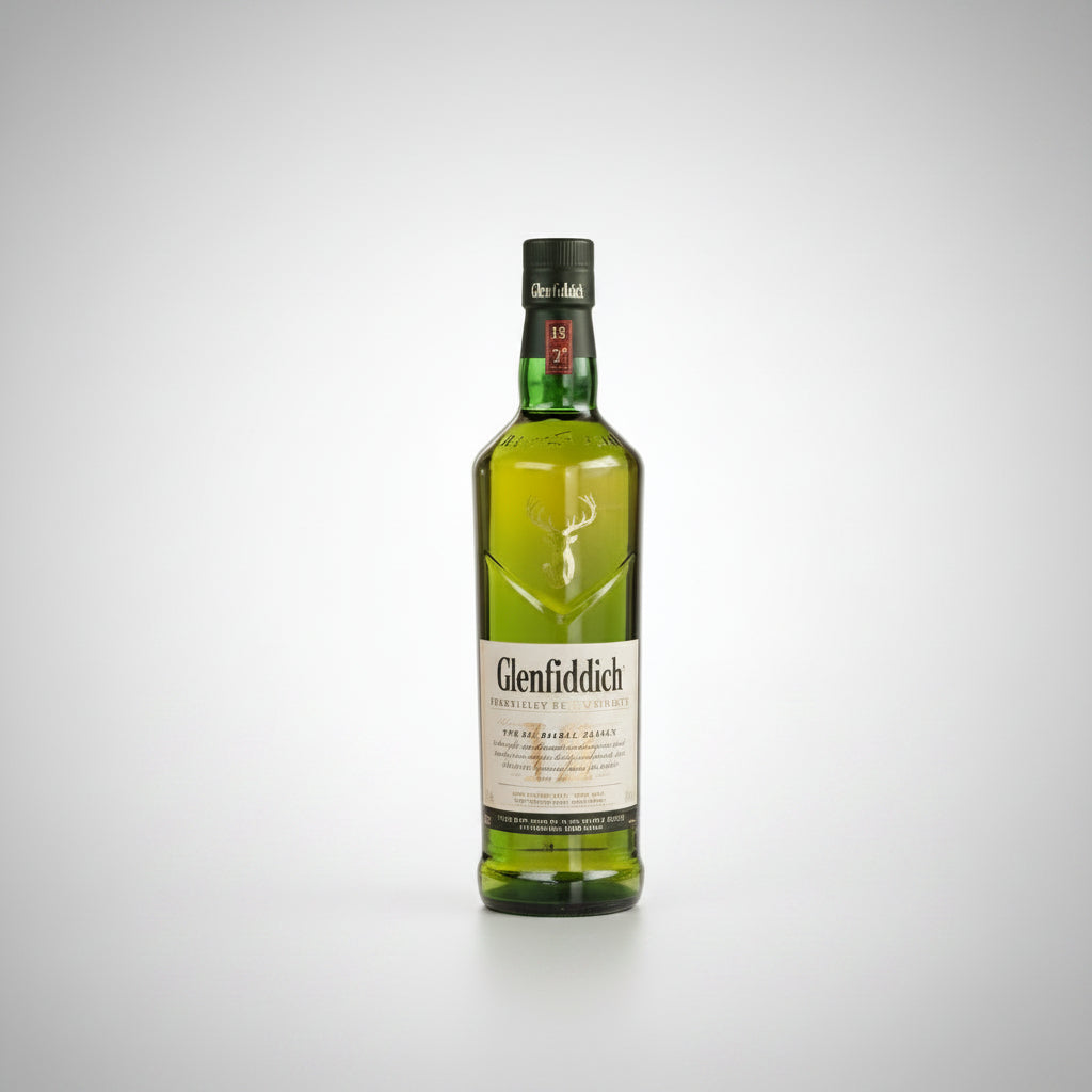 A bottle of Glenfiddich Scotch whisky centered between two clear rocks glasses containing the golden whisky, on a light gray background.