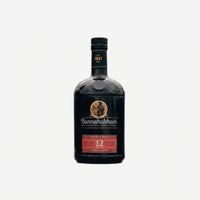 A bottle of Bunnahabhain 12 Year Old Single Malt Whisky stands next to its tall cylindrical packaging box on a clean white background.