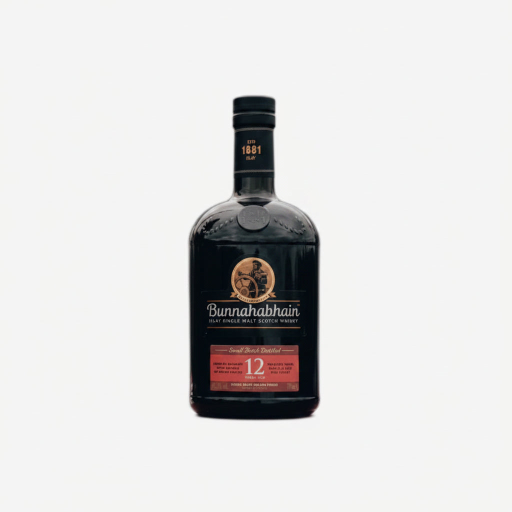 A bottle of Bunnahabhain 12 Year Old Single Malt Whisky stands next to its tall cylindrical packaging box on a clean white background.