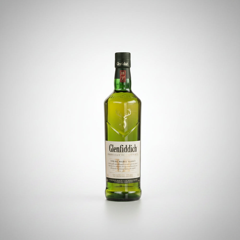 A bottle of Glenfiddich Scotch whisky centered between two clear rocks glasses containing the golden whisky, on a light gray background.