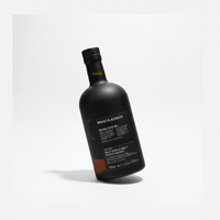 A matte black bottle of Bruichladdich 25 Year Old Single Malt Scotch Whisky on a light gray background.